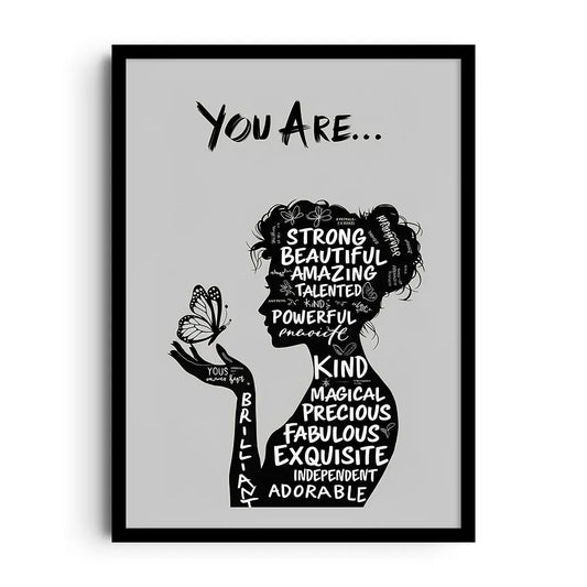 Framed poster celebrating female strength with bold typography and empowering imagery in a modern palette