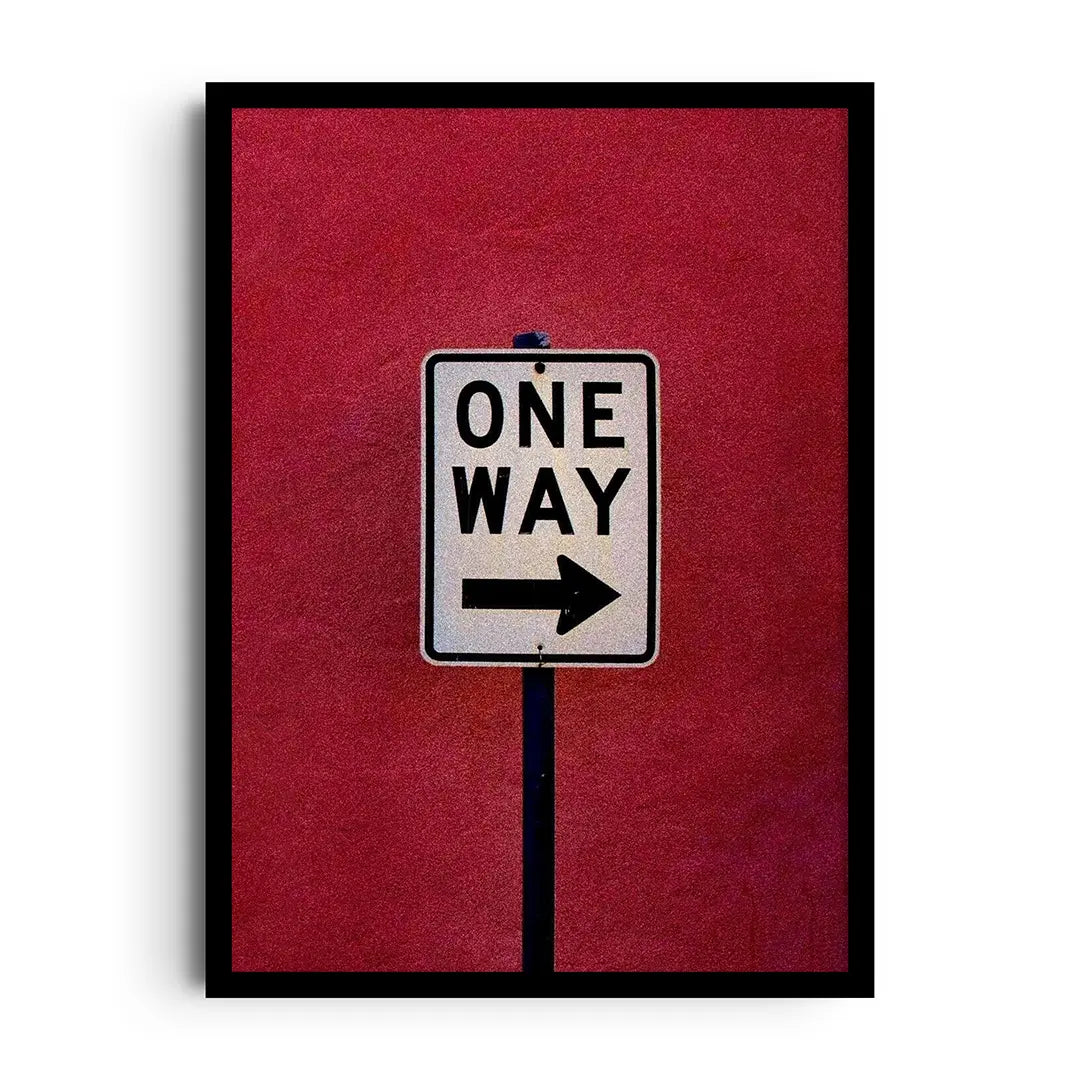 Framed poster of a bold one-way directional arrow graphic with strong contrast, modern motivational wall art