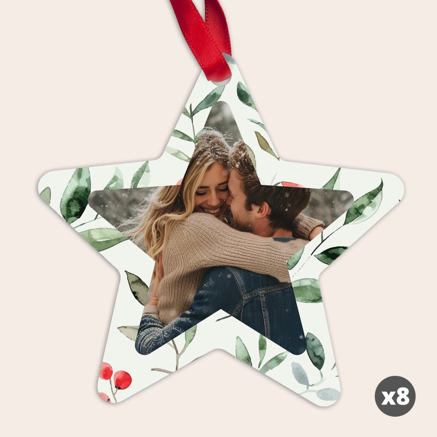 Personalized Christmas star ornament hanging on a tree, example design