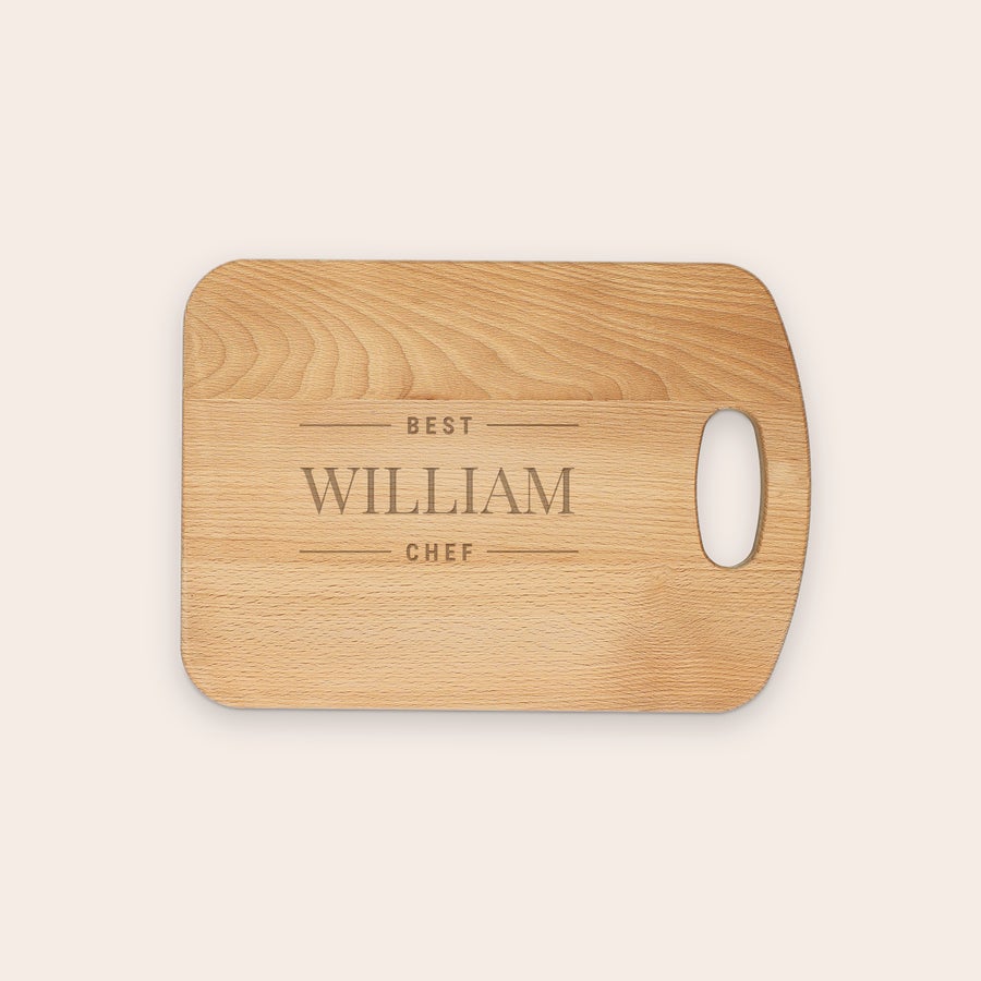 Oiled beech wood chopping board, close-up detail, with customized engraved text