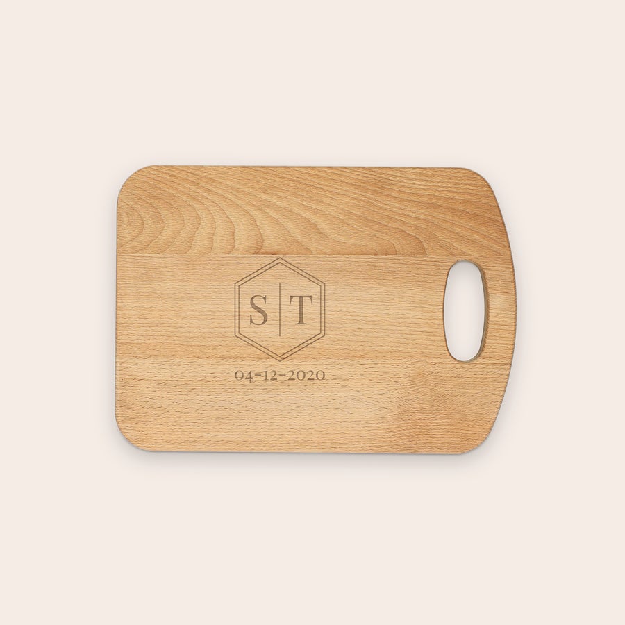Oiled beech wood chopping board, shown from another angle, with customized engraved text