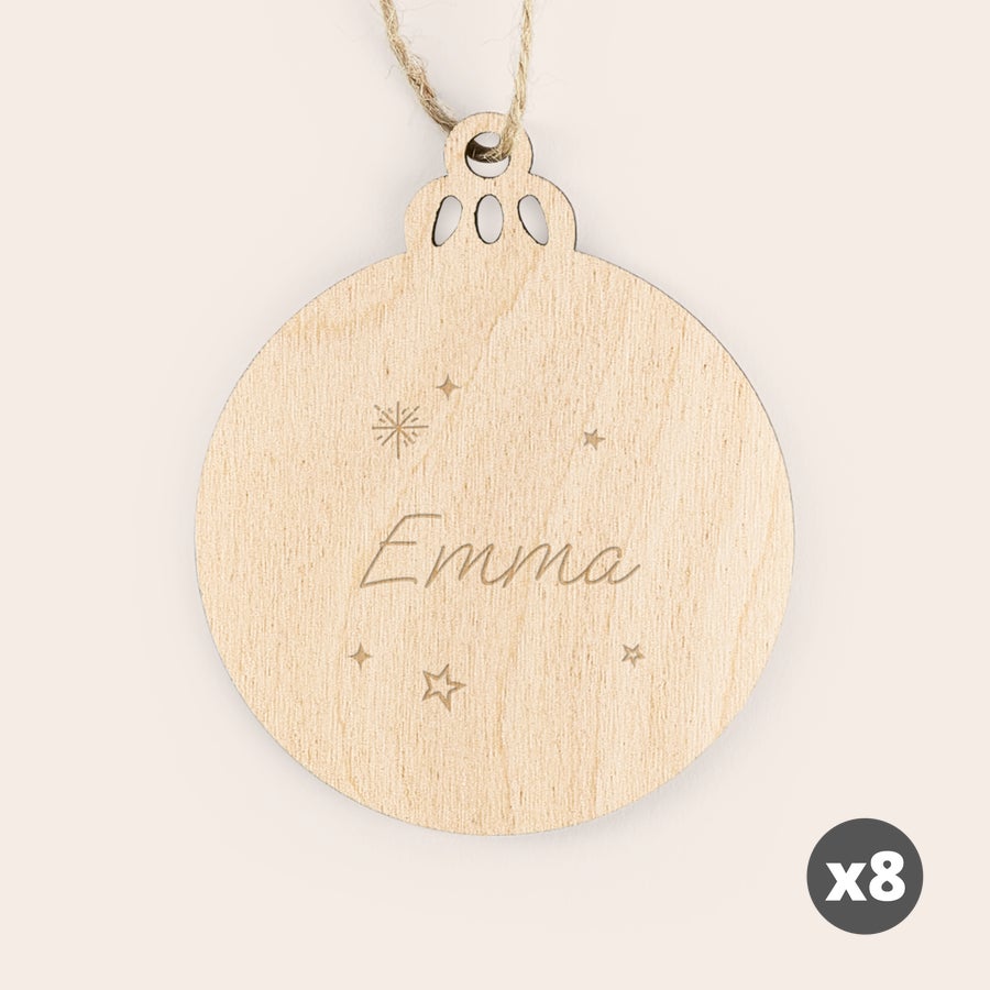 Close-up of engraved text on a wooden Christmas decoration