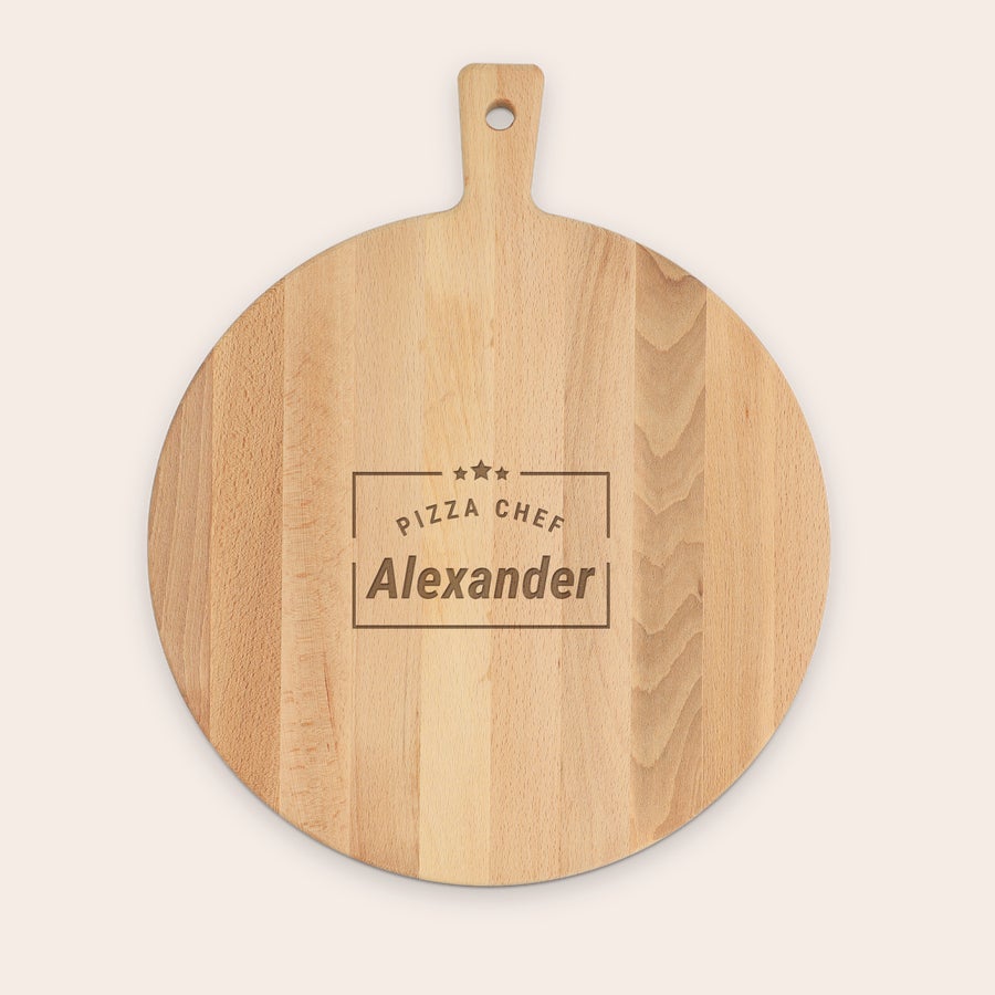 Round beech wood pizza board with handle, shown from another angle, and customized text engraving